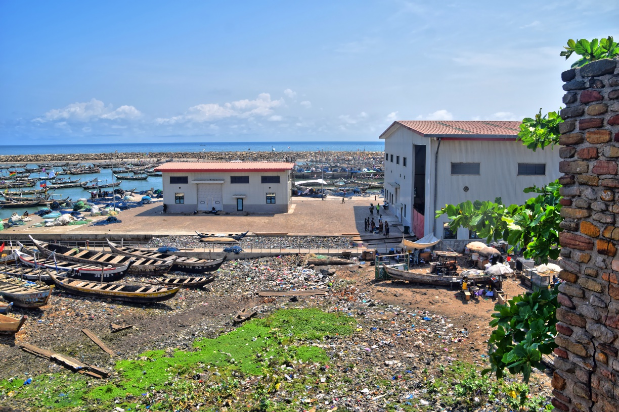Fishing boats in Jamestown harbour and the new Chinese-built storage and market buildings, seen from Fort Visao, Accra